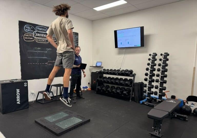 Client completing a strength test at Coastline Performance